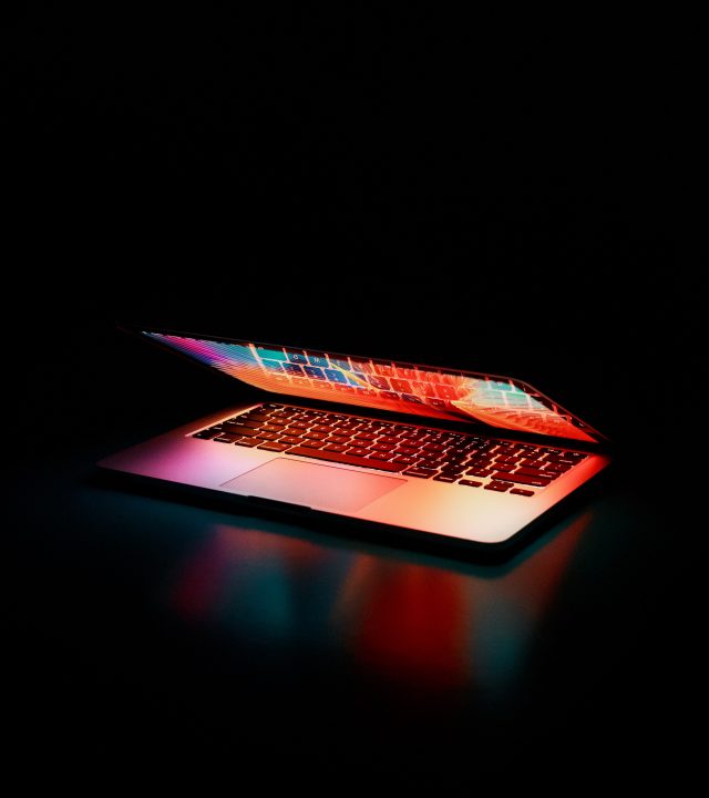 semi-opened-laptop-computer-turned-on-on-table-2047905
